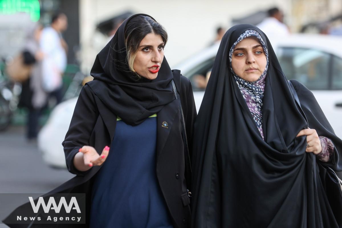 Iranian women walk in a street in Tehran, Iran October 3, 2022. WANA (West Asia News Agency)