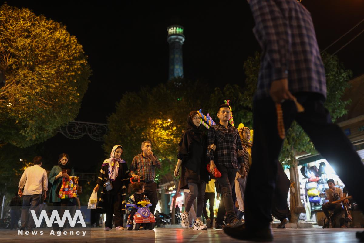 Iranians walk on a street in Tehran, Iran May 16, 2022. Picture taken May 16, 2022. Majid Asgaripour/WANA (West Asia News Agency)