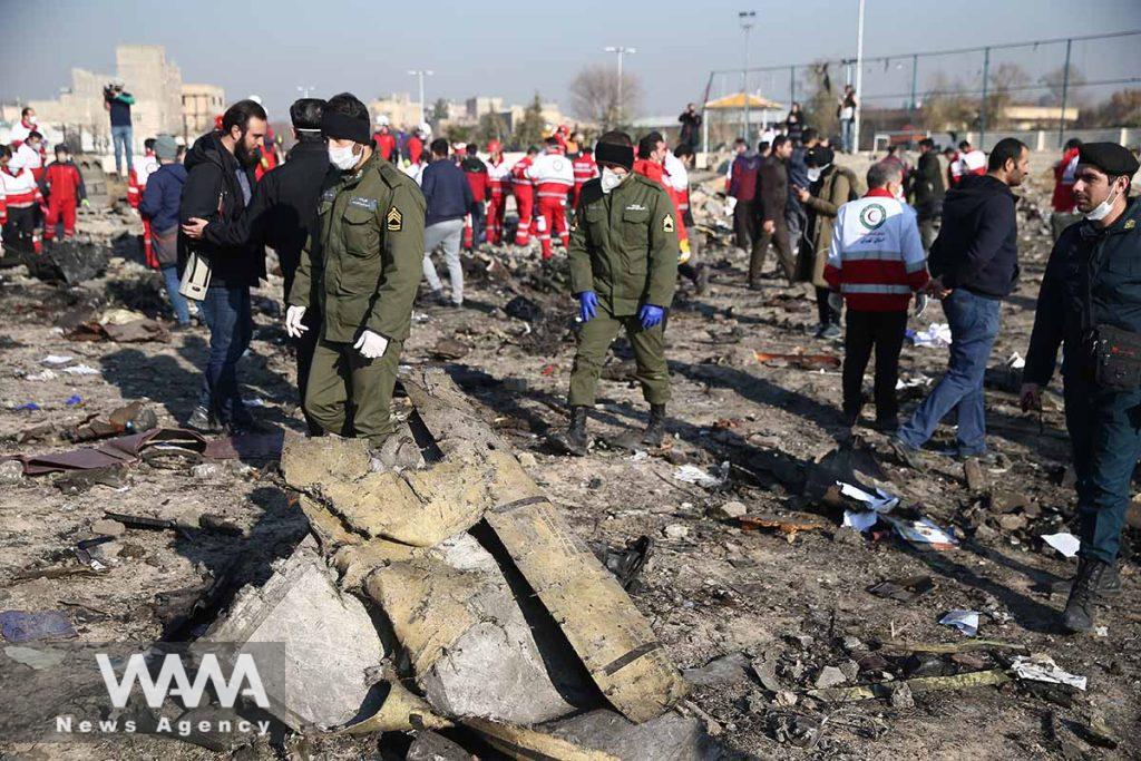 Security officers and Red Crescent workers are seen at the site where the Ukraine International Airlines plane crashed after take-off from Iran's Imam Khomeini airport, on the outskirts of Tehran, Iran January 8, 2020. Nazanin Tabatabaee/WANA (West Asia News Agency) 