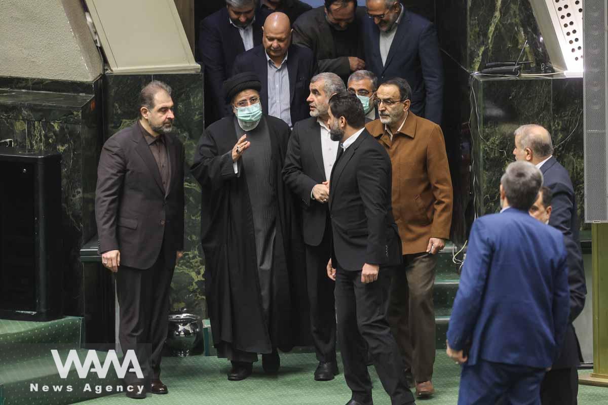 Iranian President Ebrahim Raisi greets lawmakers as he arrives during the parliament session in Tehran, Iran, January 11, 2023. Majid Asgaripour/WANA (West Asia News Agency)