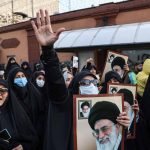 A protester holds a picture of Ayatollah Ali Khamenei, during a protest to condemn the French magazine Charlie Hebdo for republishing cartoons insulting Iran's Supreme Leader Ayatollah Ali Khamenei, in front of the French Embassy in Tehran, Iran, January 8, 2023. Majid Asgaripour/WANA (West Asia News Agency)