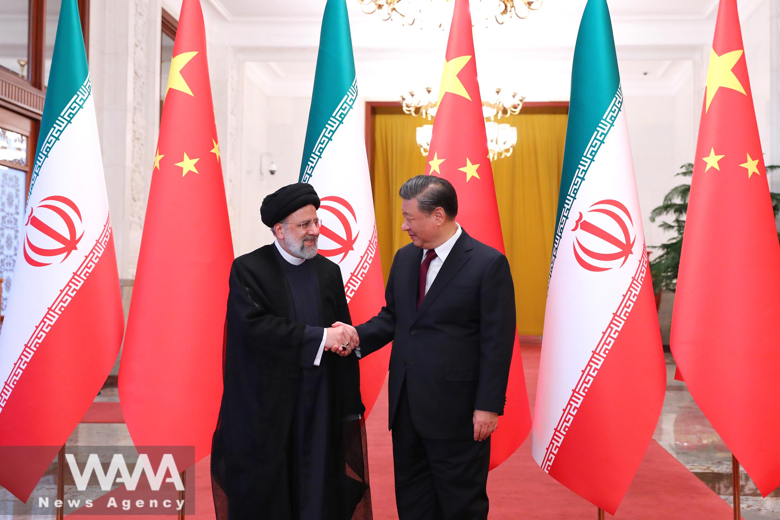 Iranian President Ebrahim Raisi shakes hands with Chinese President Xi Jinping during a welcoming ceremony in Beijing, China, February 14, 2023. Iran's President Website/WANA (West Asia News Agency)
