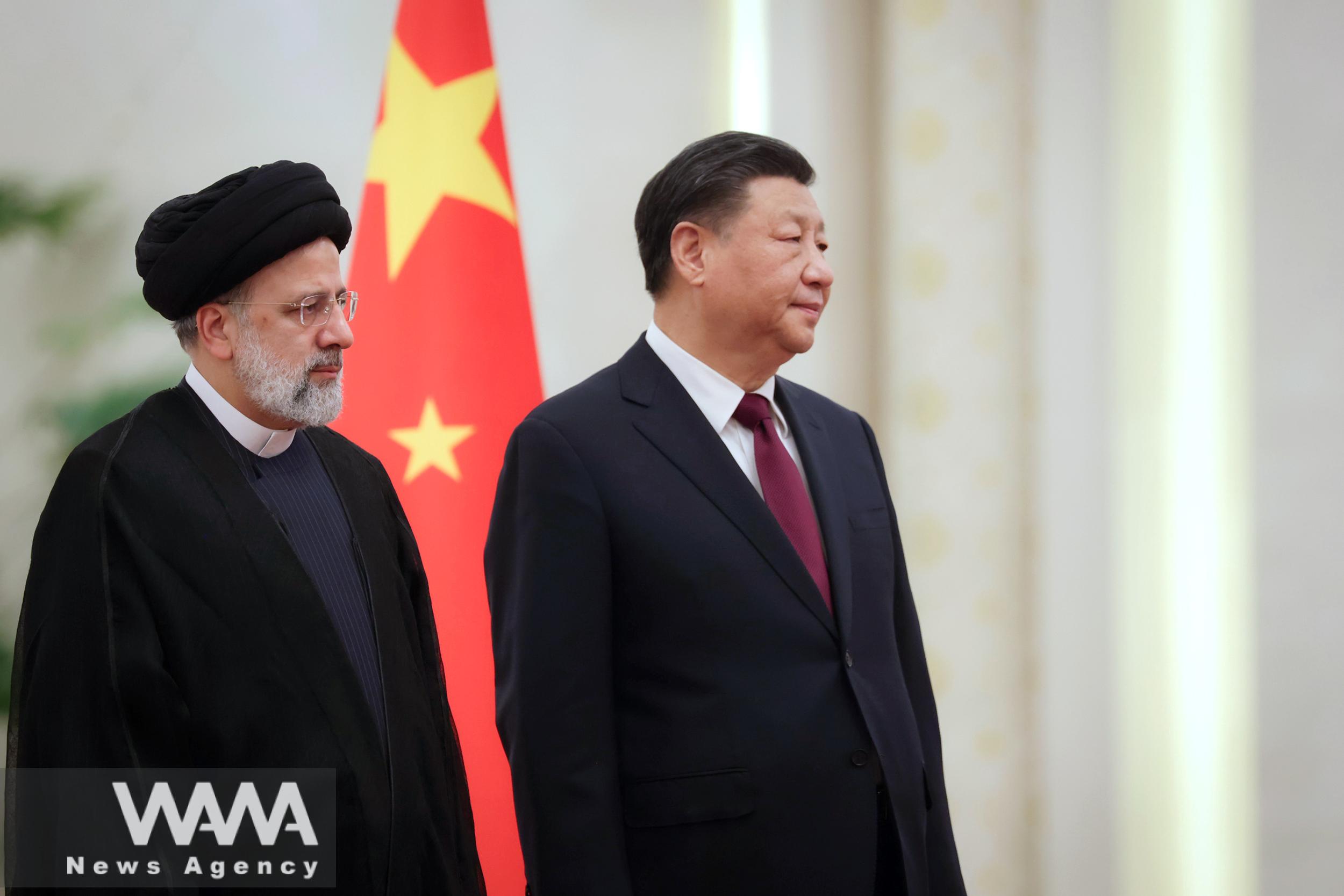 Iranian President Ebrahim Raisi stands next to Chinese President Xi Jinping during a welcoming ceremony in Beijing, China, February 14, 2023. Iran's President Website/WANA (West Asia News Agency)