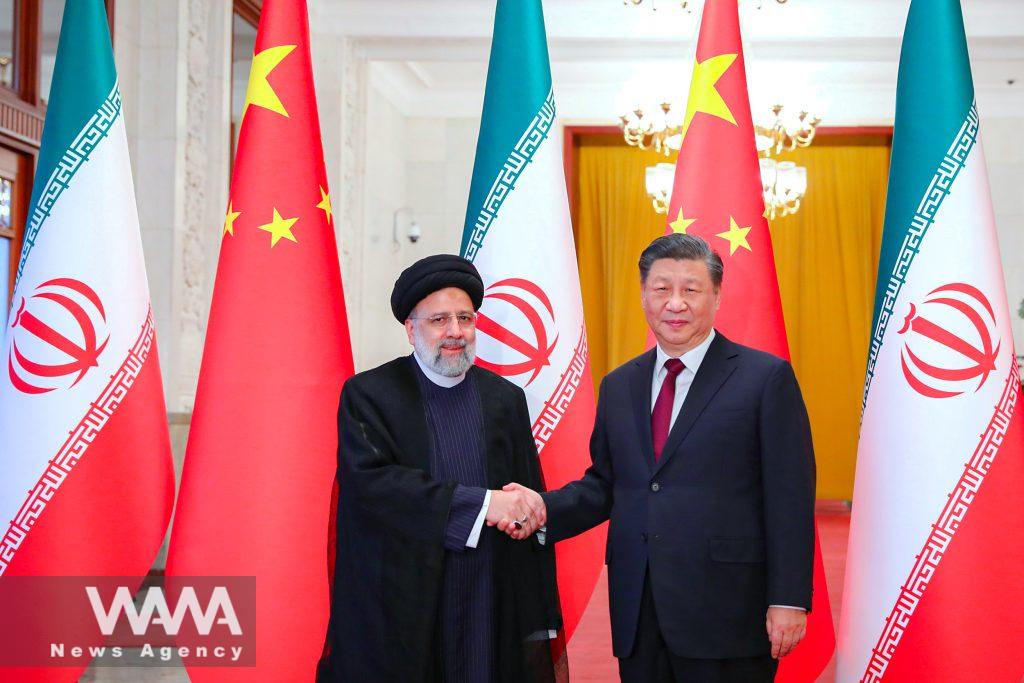 Iranian President Ebrahim Raisi shakes hands with Chinese President Xi Jinping during a welcoming ceremony in Beijing, China, February 14, 2023. Iran's President Website/WANA (West Asia News Agency)