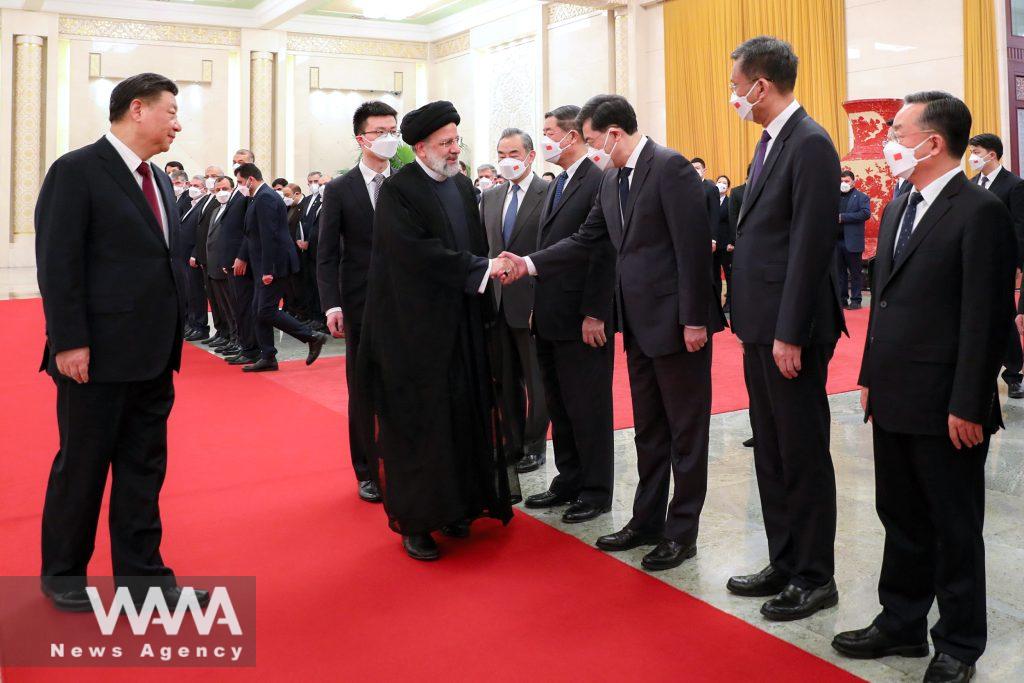 Iranian President Ebrahim Raisi walks with Chinese President Xi Jinping during a welcoming ceremony in Beijing, China, February 14, 2023. Iran's President Website/WANA (West Asia News Agency)