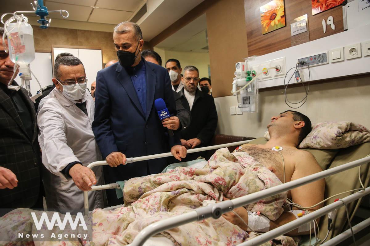 Iran's Foreign Minister Hossein Amir-Abdollahian visits one of the injured in the attack at the Embassy of the Republic of Azerbaijan in Tajrish hospital in Tehran, Iran, January 27, 2023. pool/WANA (West Asia News Agency)