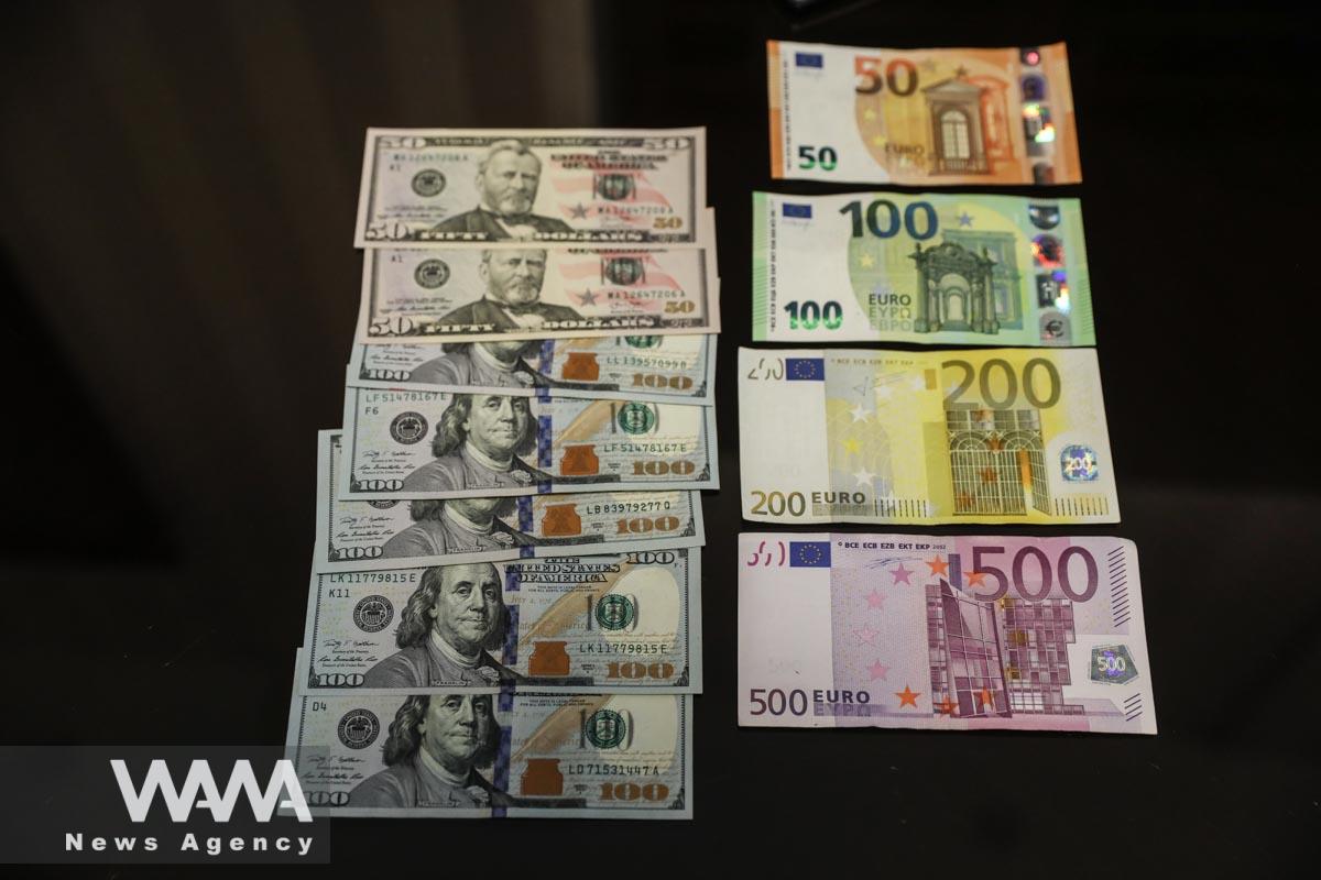 Dollars and Euros are seen in an exchange office in Tehran, Iran, February 21, 2023. Majid Asgaripour/WANA (West Asia News Agency)