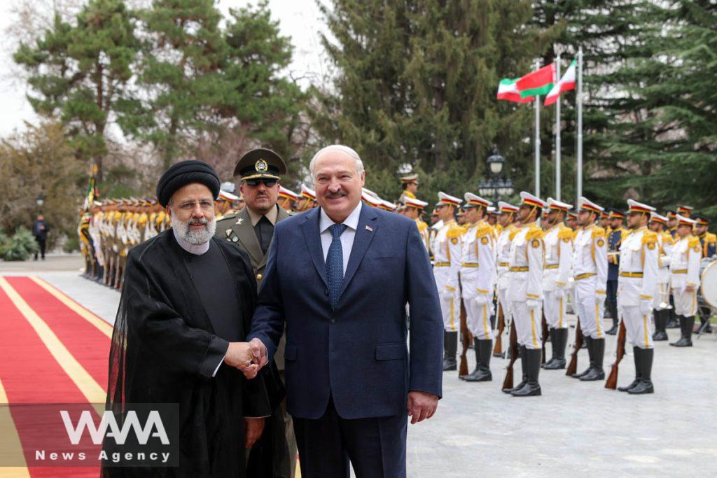 Iranian President Ebrahim Raisi shakes hands with Belarus President Alexander Lukashenko during a welcoming ceremony in Tehran, Iran, March 13, 2023. Iran's President Website/WANA (West Asia News Agency)