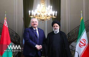 Iranian President Ebrahim Raisi shakes hands with Belarus President Alexander Lukashenko after the joint news conference in Tehran, Iran, March 13, 2023. Iran's President Website/WANA (West Asia News Agency)