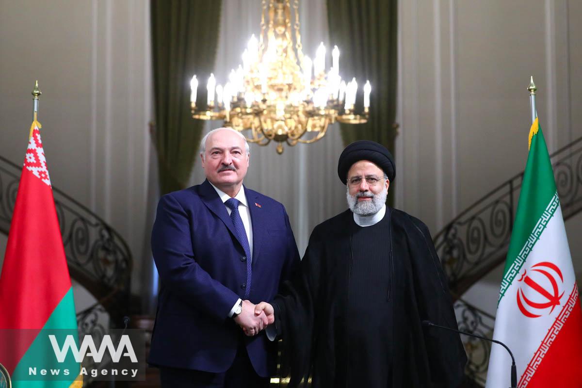 Iranian President Ebrahim Raisi shakes hands with Belarus President Alexander Lukashenko after the joint news conference in Tehran, Iran, March 13, 2023. Iran's President Website/WANA (West Asia News Agency)