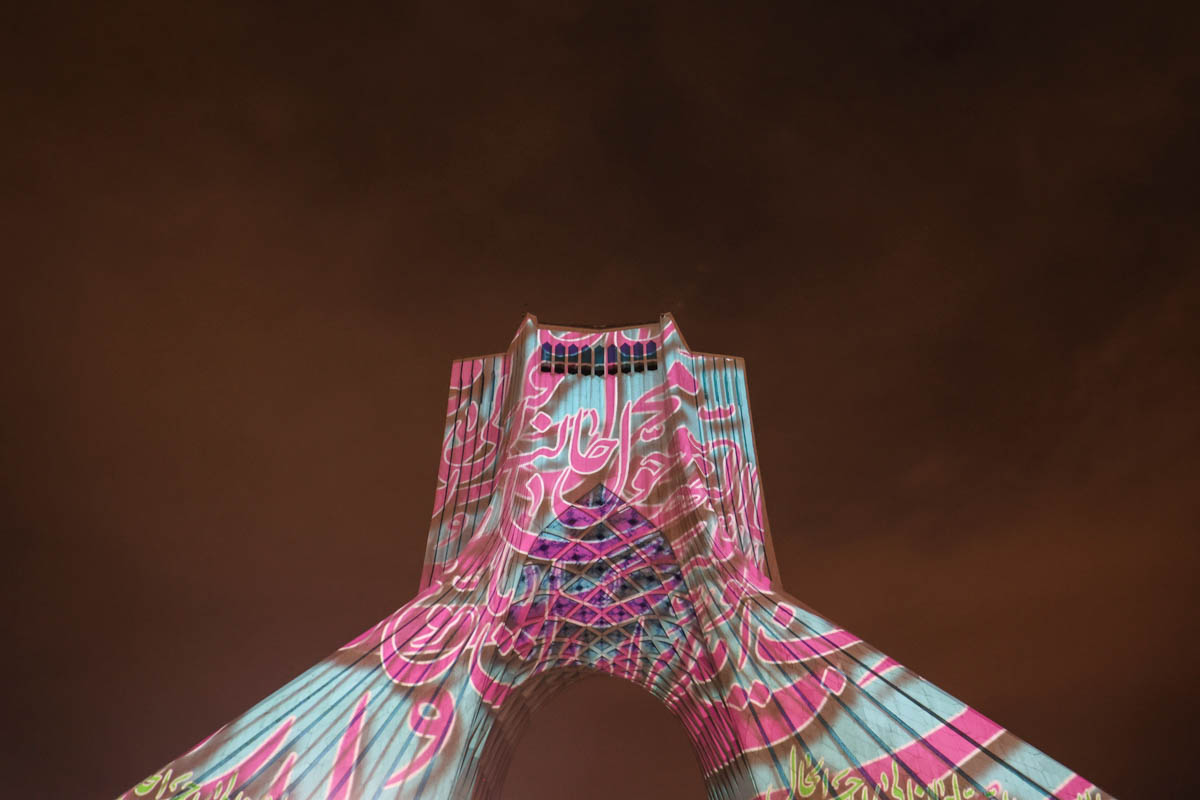 Pictures are projected on the Azadi tower during a video mapping light show to celebrate the Iranian New Year Nowruz in Tehran, Iran March 21, 2023. Majid Asgaripour/WANA (West Asia News Agency)