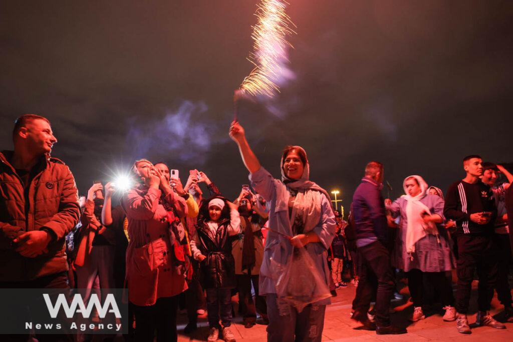 Iranians celebrate the Iranian New Year Nowruz next to the Azadi Tower in Tehran, Iran March 21, 2023. Majid Asgaripour/WANA (West Asia News Agency)