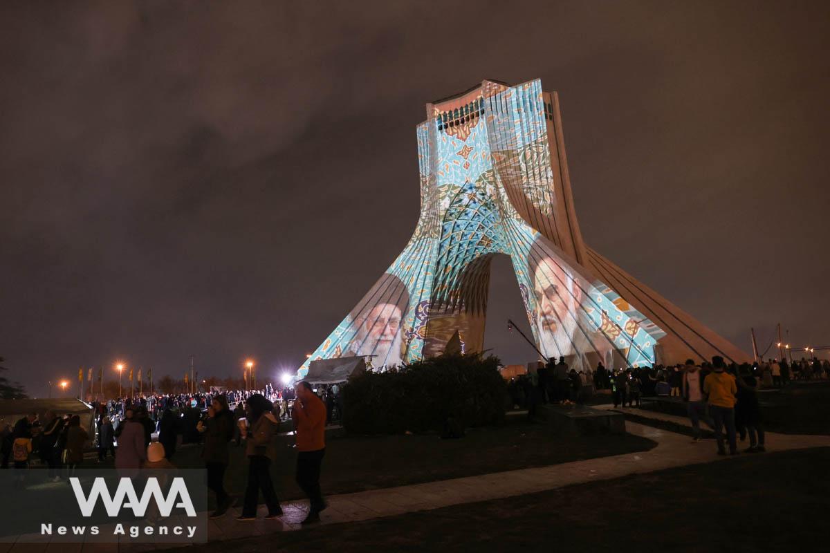 The late leader of the Islamic Revolution Ayatollah Ruhollah Khomeini and Iran's Supreme Leader Ayatollah Ali Khamenei images are projected on the Azadi tower during a video mapping light show to celebrate the Iranian New Year Nowruz in Tehran, Iran March 21, 2023. Majid Asgaripour/WANA (West Asia News Agency)