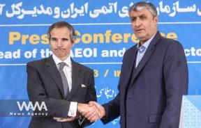 Head of Iran's Atomic Energy Organization Mohammad Eslami and International Atomic Energy Agency (IAEA) Director General Rafael Grossi shake hands after a news conference, in Tehran, Iran, March 4, 2023. Majid Asgaripour/WANA (West Asia News Agency)