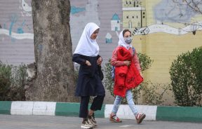Iranian female students walk in a street in Tehran, Iran, March 7, 2023. Majid Asgaripour/WANA (West Asia News Agency)