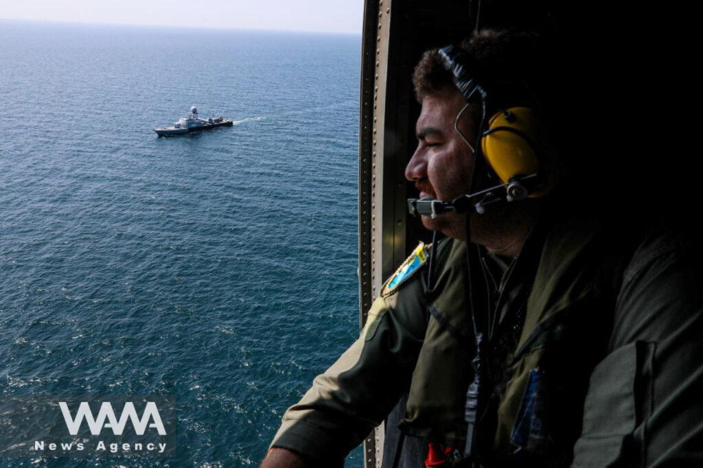An Iranian Army helicopter crew member is seen during a joint naval military drill between Iran, Russia, and China in the Gulf of Oman, Iran March 15, 2023. Iranian Army/WANA (West Asia News Agency)