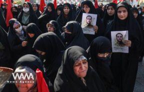 Iranian women hold pictures of Milad Heydari a member of Iran's Islamic Revolution Guards Corps (IRGC) who was killed in an Israeli airstrike on Damascus, held in Tehran, Iran, April 4, 2023. Majid Asgaripour/WANA (West Asia News Agency)