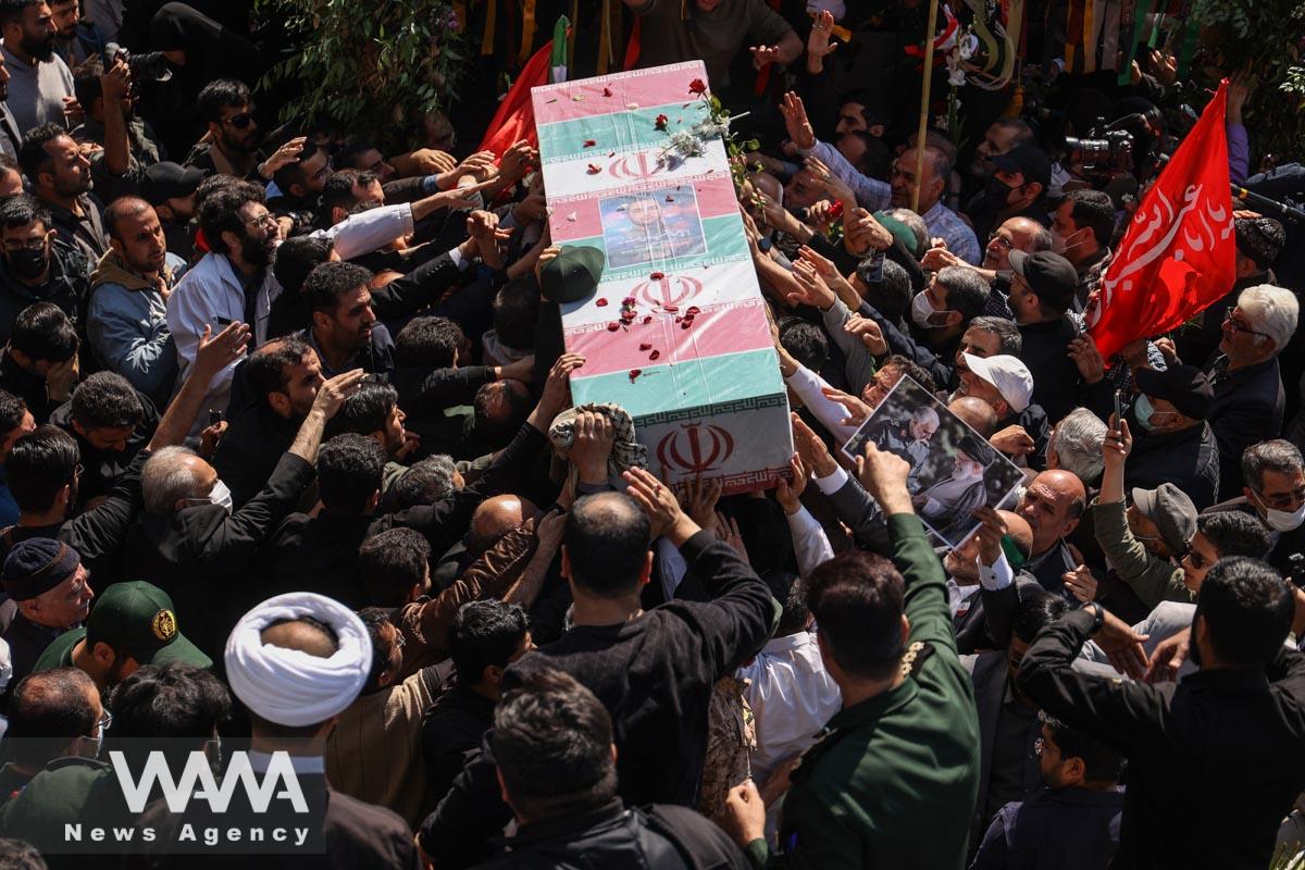 People carry the coffin of Milad Heydari a member of Iran's Islamic Revolution Guards Corps (IRGC) who was killed in an Israeli airstrike on Damascus, held in Tehran, Iran, April 4, 2023. Majid Asgaripour/WANA (West Asia News Agency)