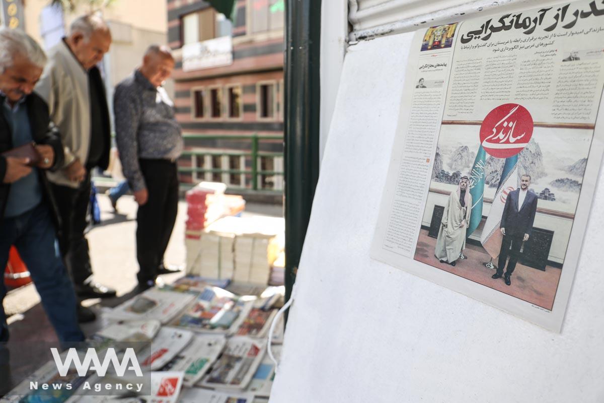 A newspaper with a cover picture of the meeting between the foreign ministers of Iran and Saudi Arabia is seen in Tehran, Iran April 8, 2023. Majid Asgaripour/WANA (West Asia News Agency)