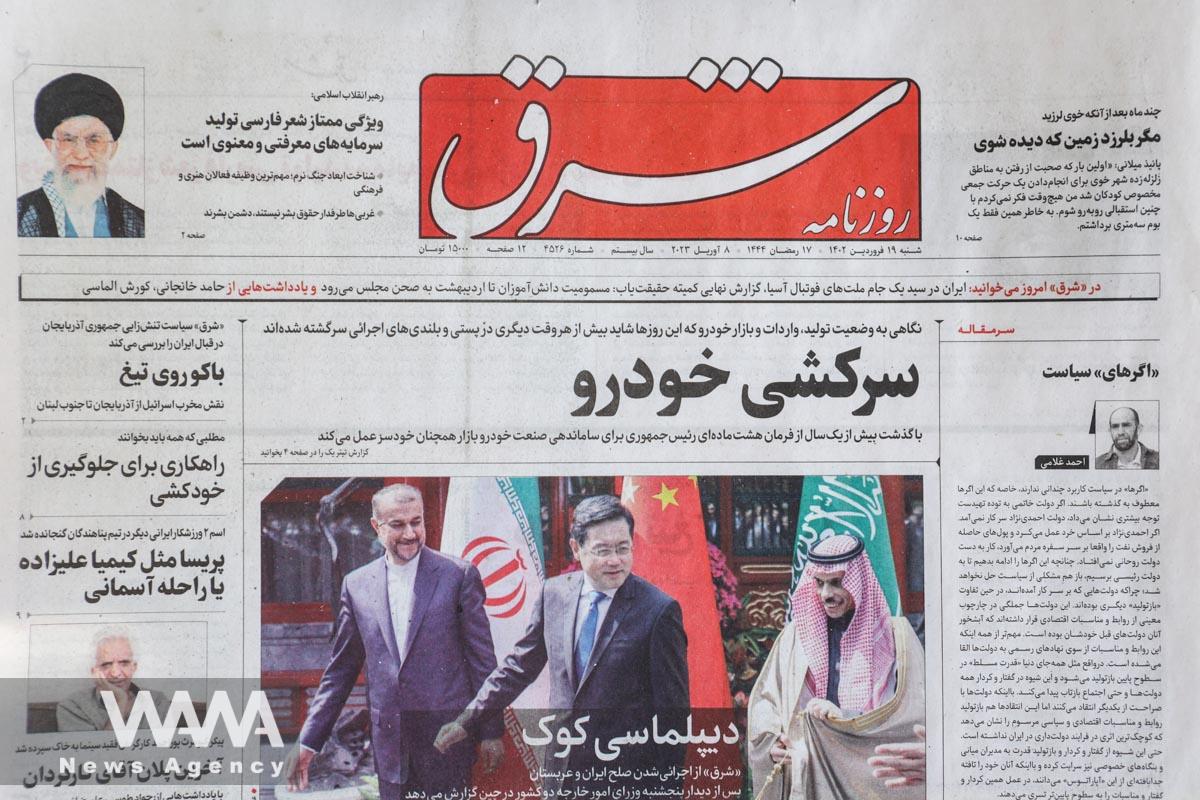 A newspaper with a cover picture of the meeting between the foreign ministers of Iran and Saudi Arabia is seen in Tehran, Iran April 8, 2023. Majid Asgaripour/WANA (West Asia News Agency)
