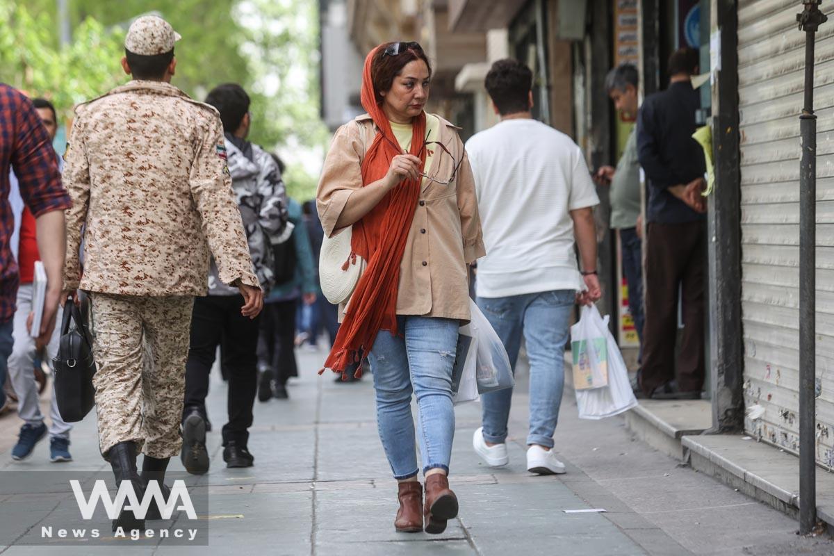 An Iranian woman walks in a street in Tehran, Iran, April 9, 2023. Majid Asgaripour/WANA (West Asia News Agency)