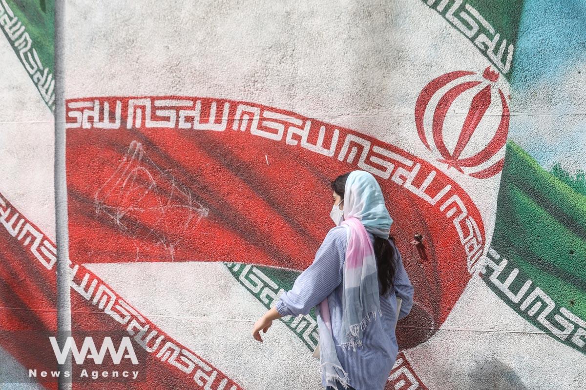 An Iranian woman walks in a street in Tehran, Iran, April 9, 2023. Majid Asgaripour/WANA (West Asia News Agency)