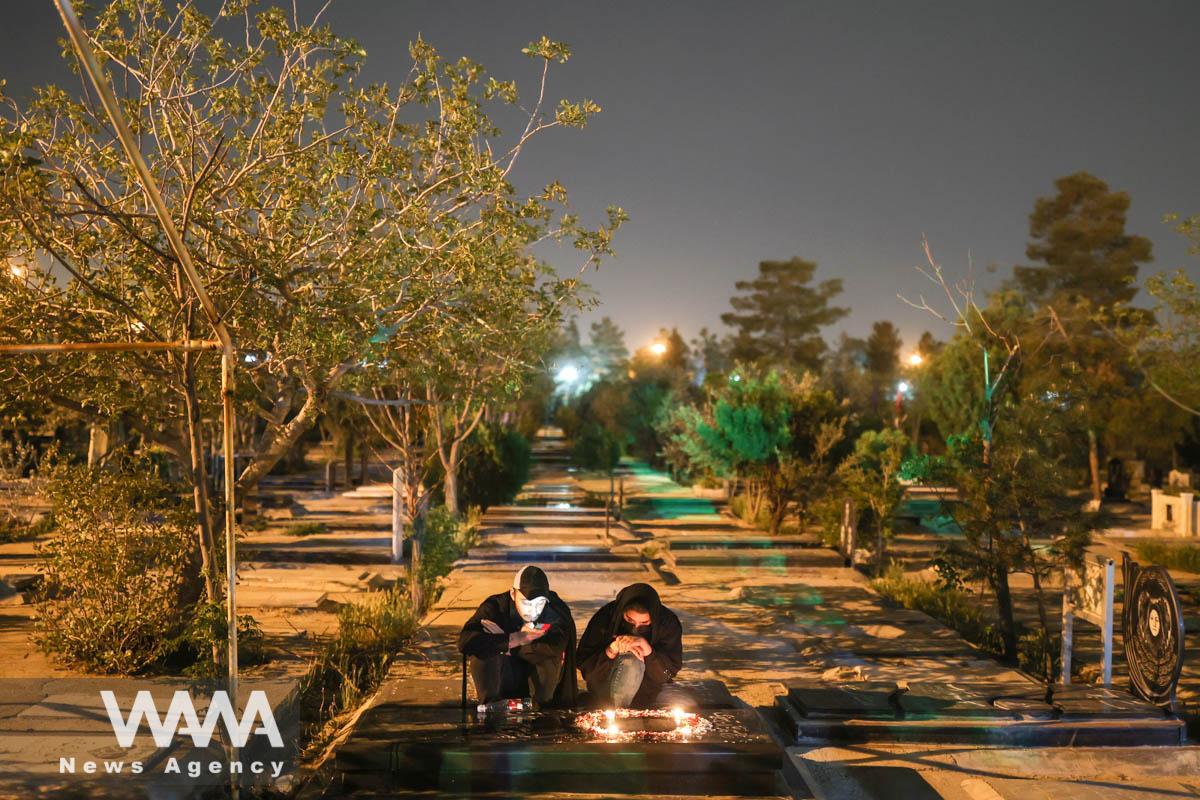 Iranian Shiite Muslims pray in Laylat al-Qadr, during the holy month of Ramadan in Behesht-e-Zahra Cemetery in south of Tehran, Iran, April 9, 2023. Majid Asgaripour/WANA (West Asia News Agency)