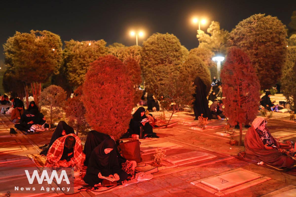 Iranian Shiite Muslims pray in Laylat al-Qadr, during the holy month of Ramadan in Behesht-e-Zahra Cemetery in south of Tehran, Iran, April 10, 2023. Majid Asgaripour/WANA (West Asia News Agency)