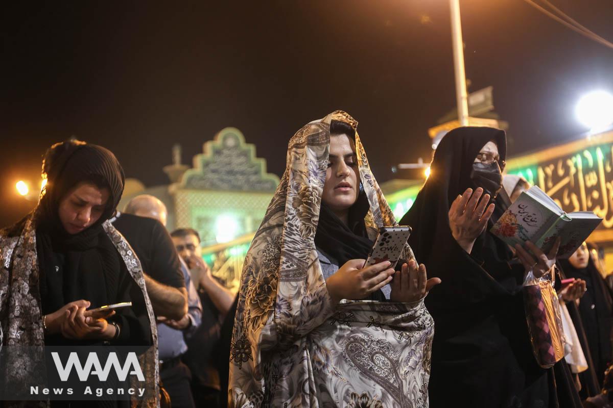 Iranian Shiite Muslims pray while marking the death anniversary of Imam Ali, during the holy month of Ramadan, at the shrine of Abdol-Azim in Tehran, Iran, April 11, 2023. Majid Asgaripour/WANA (West Asia News Agency)