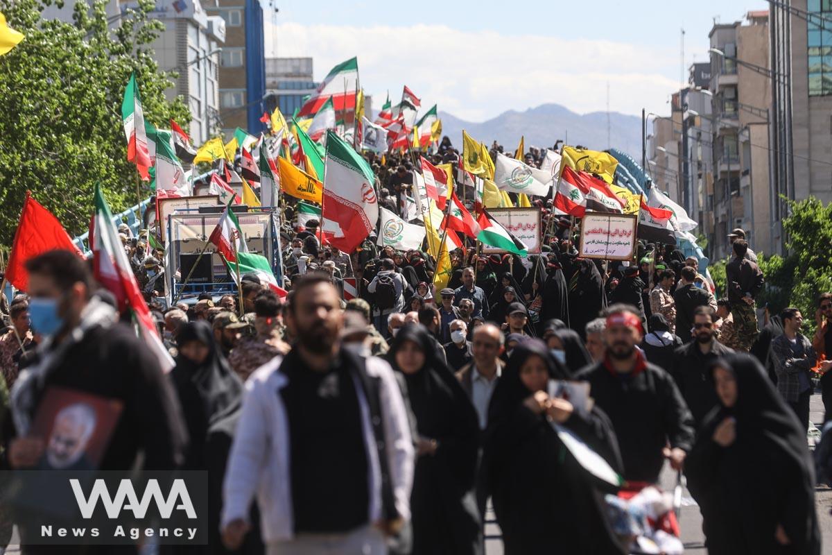 Iranians hold flags during a rally marking the annual Quds Day, or Jerusalem Day, on the last Friday of the holy month of Ramadan in Tehran, Iran April 14, 2023. Majid Asgaripour/WANA (West Asia News Agency)