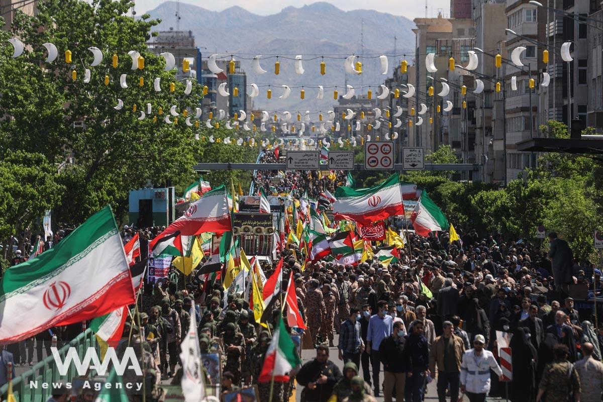 Iranians hold flags during a rally marking the annual Quds Day, or Jerusalem Day, on the last Friday of the holy month of Ramadan in Tehran, Iran April 14, 2023. Majid Asgaripour/WANA (West Asia News Agency)