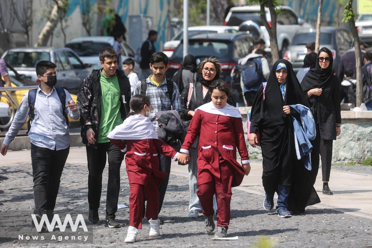 Iranian women walk in a street amid the implementation of new hijab surveillance in Tehran, Iran, April 15, 2023. Majid Asgaripour/WANA (West Asia News Agency)