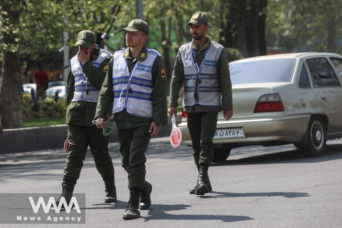 Iran's police forces walk in a street amid the implementation of new hijab surveillance in Tehran, Iran, April 15, 2023. Majid Asgaripour/WANA (West Asia News Agency)