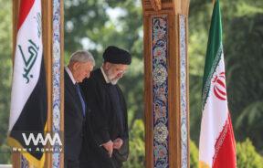 Iranian President Ebrahim Raisi stands next to Iraqi President Abdul Latif Rashid during a welcoming ceremony in Tehran, Iran, April 29, 2023. Majid Asgaripour/WANA (West Asia News Agency)