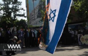 Iranians burn an Israeli flag during a rally marking the annual Quds Day, or Jerusalem Day, in Tehran, Iran May 7, 2021.