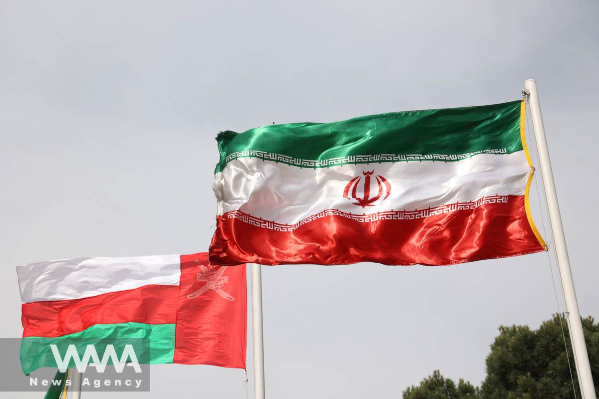 The flags of Iran and Oman are seen when Oman's Sultan Haitham bin Tariq arrives at Mehrabad Airport in Tehran, Iran May 28, 2023. Majid Asgaripour/WANA (West Asia News Agency)