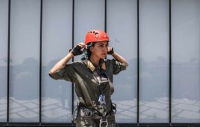 An Iranian female Sogand Salari wears her helmet as she gets ready to clean windows of highrise buildings in Tehran, Iran June 20, 2023. Majid Asgaripour/WANA (West Asia News Agency)