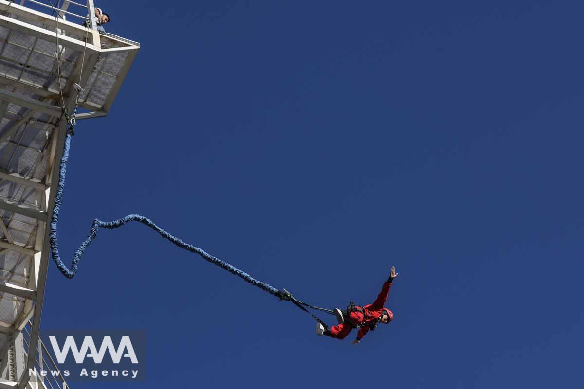 An Iranian female Sogand Salari makes a bungee jump, at Adrenaline Park in Tehran, Iran June 21, 2023. Majid Asgaripour/WANA (West Asia News Agency)
