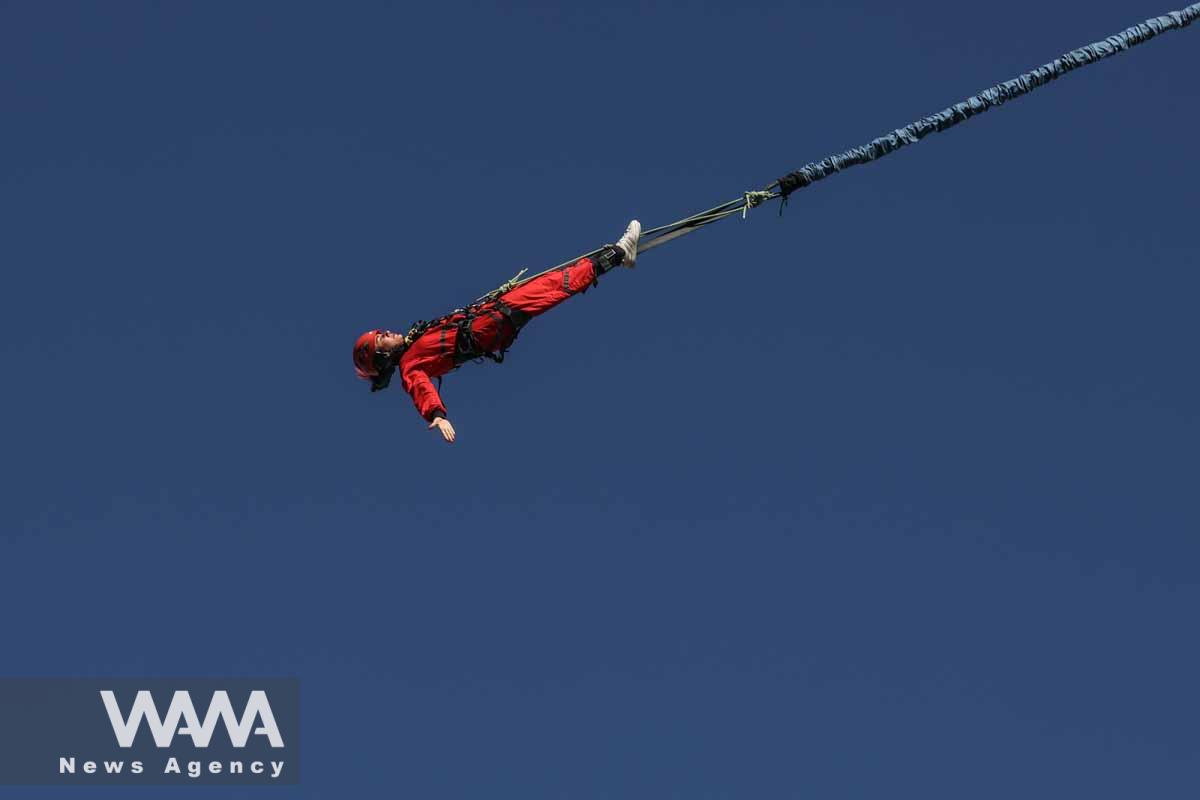 An Iranian female Sogand Salari makes a bungee jump, at Adrenaline Park in Tehran, Iran June 21, 2023. Majid Asgaripour/WANA (West Asia News Agency)