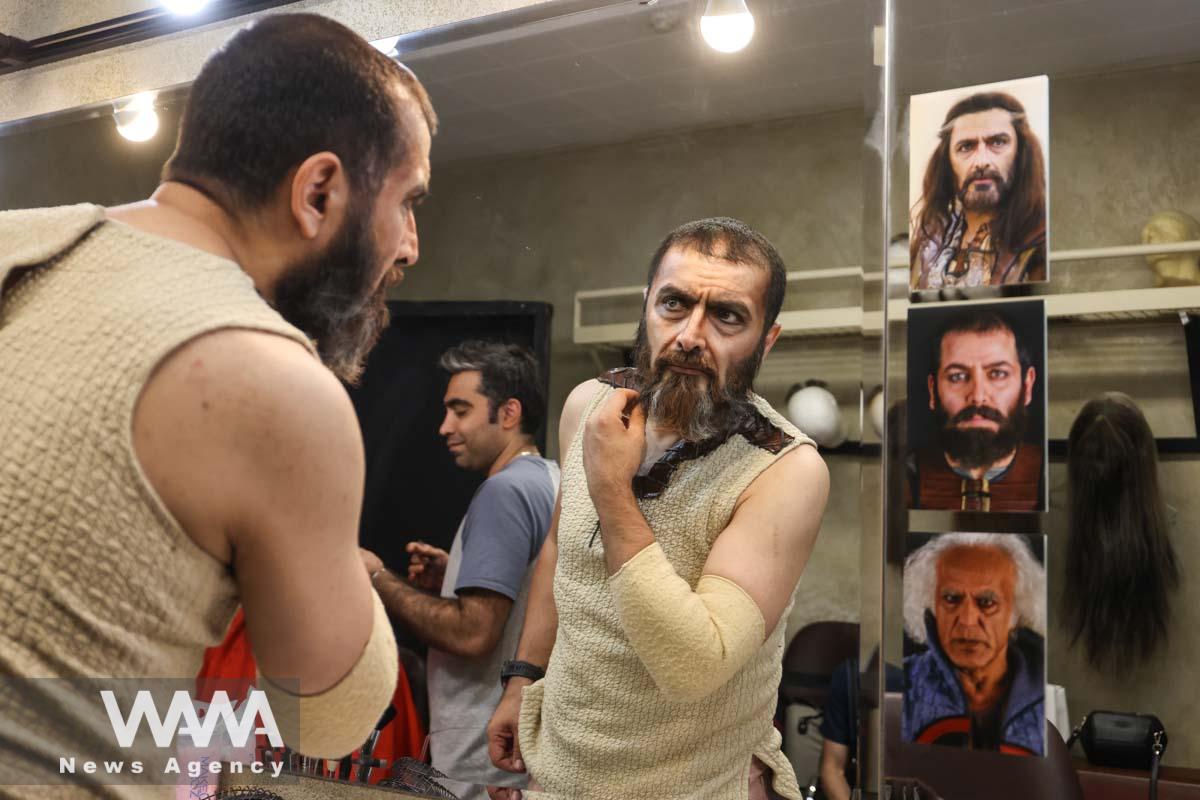 Iranian actor Amin Zendegani gets his makeup done backstage before performing in the 'Haft-Khan Esfandiar' musical theater production at the Vahdat Hall in Tehran, Iran, 27 June 2023. Majid Asgaripour/WANA (West Asia News Agency)