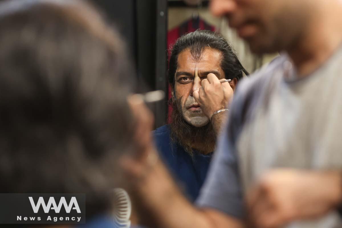 Iranian actor Banipal Shoomoon gets his makeup done backstage before performing in the 'Haft-Khan Esfandiar' musical theater production at the Vahdat Hall in Tehran, Iran, 27 June 2023. Majid Asgaripour/WANA (West Asia News Agency)
