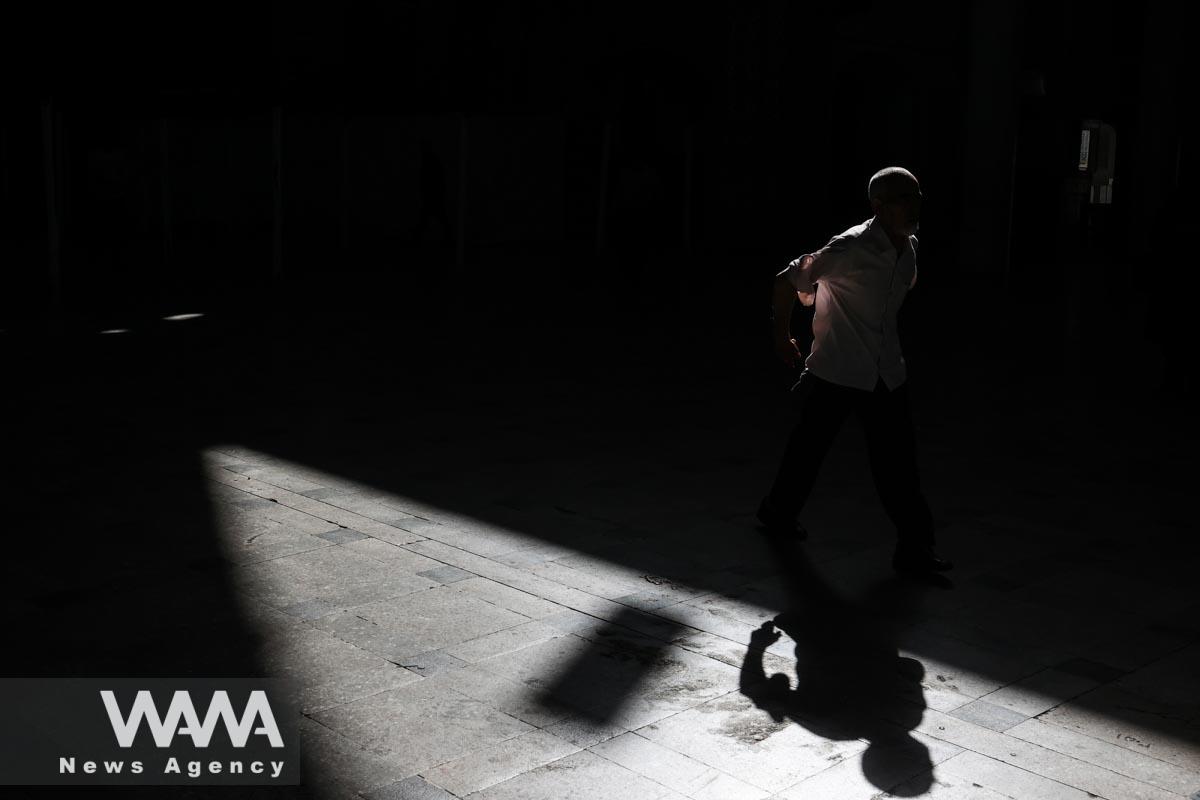 An Iranian man enters a mosque to pray on Eid al-Adha at the shrine of Abdol-Azim in Tehran, Iran June 29, 2023. Majid Asgaripour/WANA (West Asia News Agency)