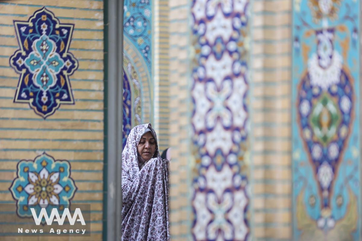 An Iranian woman prays on Eid al-Adha at the shrine of Abdol-Azim in Tehran, Iran June 29, 2023. Majid Asgaripour/WANA (West Asia News Agency)