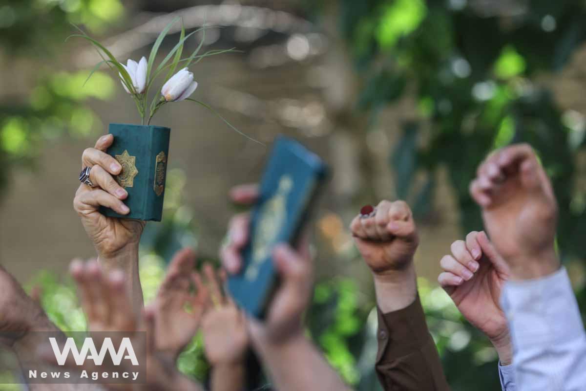 An Iranian protester holds the Quran in his hand during a protest against a man who burned a copy of the Quran outside a mosque in the Swedish capital Stockholm, in front of the Swedish Embassy in Tehran, Iran June 30, 2023. Majid Asgaripour/WANA (West Asia News Agency)