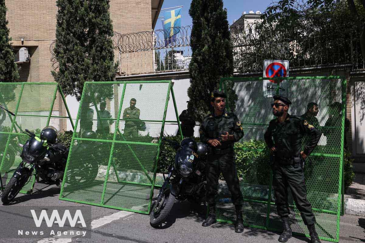 Police stand guard outside the French embassy during a protest against a man who burned a copy of the Quran outside a mosque in the Swedish capital Stockholm, in front of the Swedish Embassy in Tehran, Iran June 30, 2023. Majid Asgaripour/WANA (West Asia News Agency)