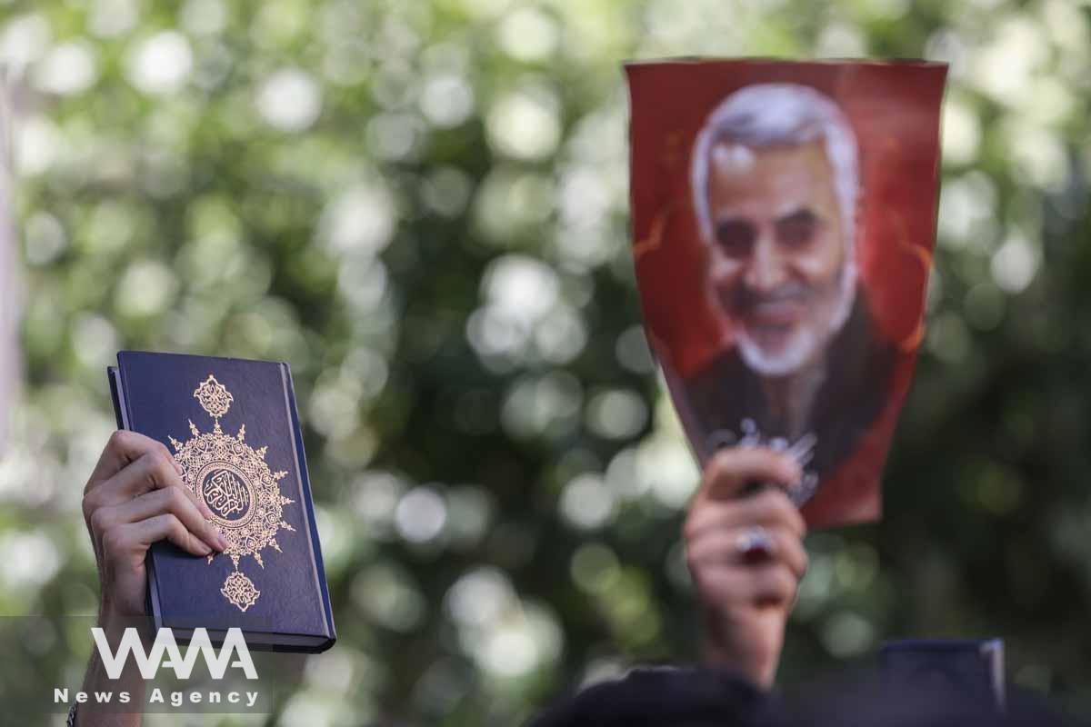 An Iranian protester holds the Quran in his hand during a protest against a man who burned a copy of the Quran outside a mosque in the Swedish capital Stockholm, in front of the Swedish Embassy in Tehran, Iran June 30, 2023. Majid Asgaripour/WANA (West Asia News Agency)