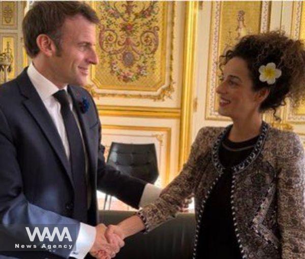 President Emmanuel Macron shaking hands with Iranian activist Masih Alinejad. Nov. 11, 2022. Social Media / WANA News Agency