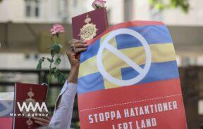 An Iranian protester holds the Quran in his hand during a protest against a man who burned a copy of the Quran outside a mosque in the Swedish capital Stockholm, in front of the Swedish Embassy in Tehran, Iran July 3, 2023. Majid Asgaripour/WANA (West Asia News Agency)