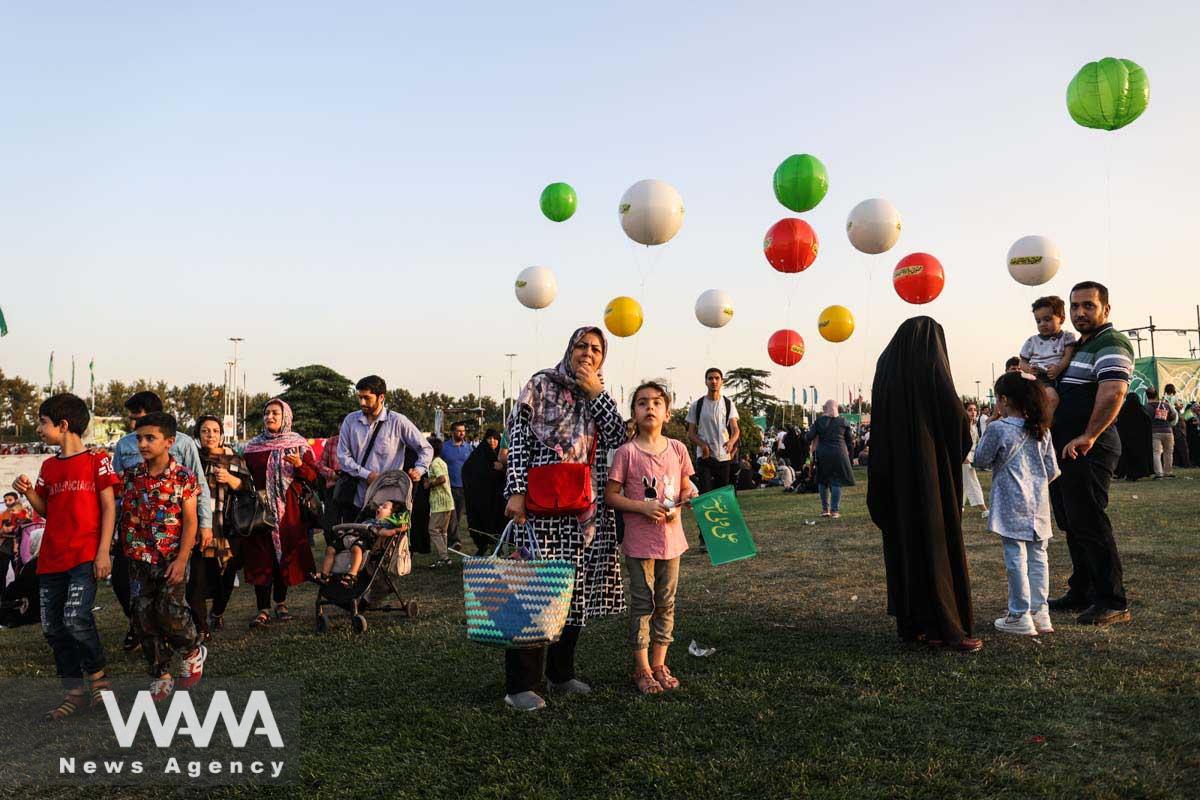 People attend the Ghadir Eid street festival in Tehran, Iran July 7, 2023. Majid Asgaripour/WANA (West Asia News Agency)