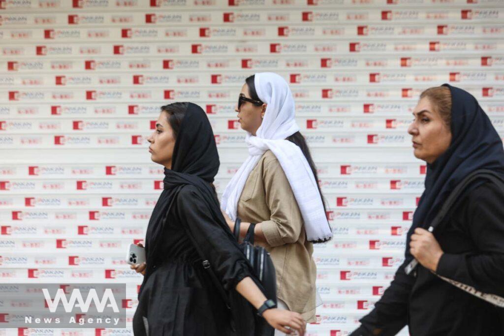 Iranian women walk on a street during the revival of morality police in Tehran, Iran, July 16, 2023. Majid Asgaripour/WANA (West Asia News Agency)